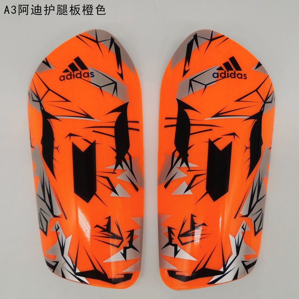 Espinillera Adidas Naranja Con Gris